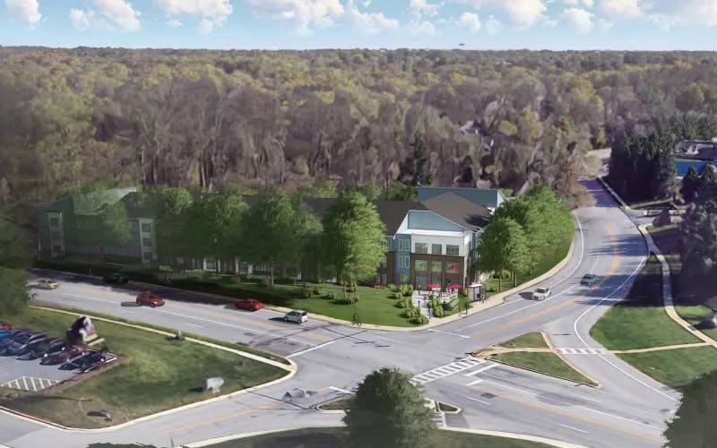 Patuxent Commons render with building on the corner of a traffic intersection